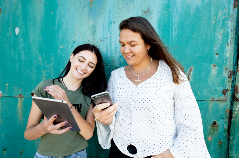 Wahine using phone and tablet